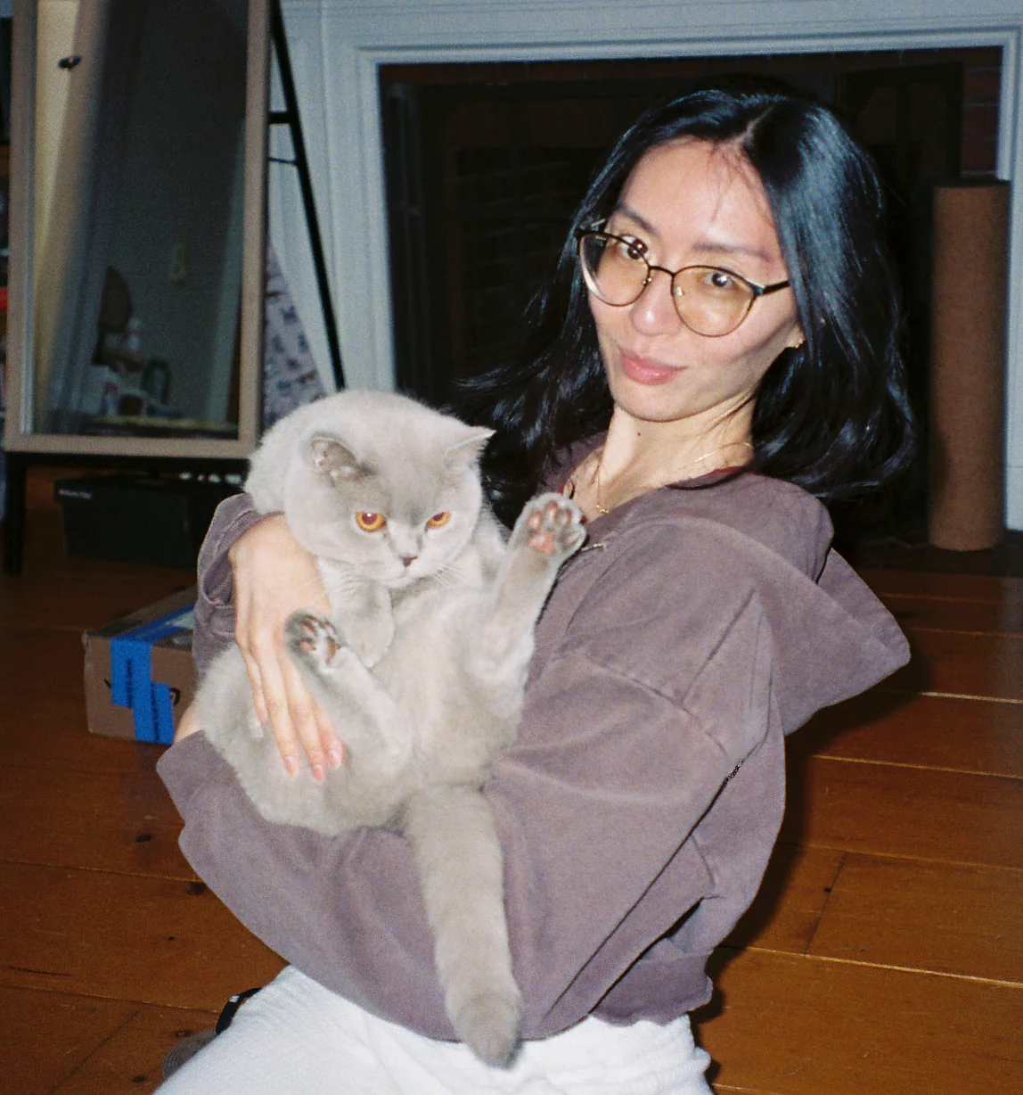 Yvonne holding a grey British Shorthair cat